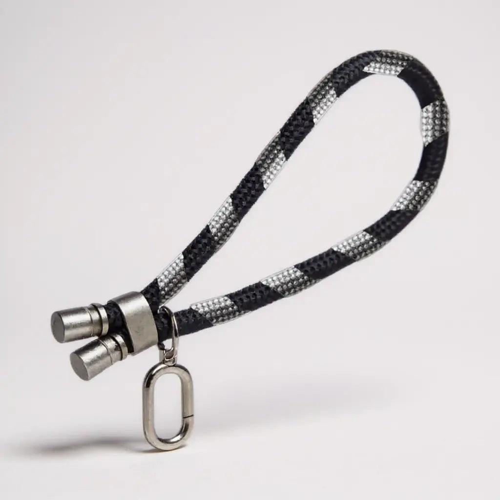 Lanyard de mano color negro para dispositivos móviles.