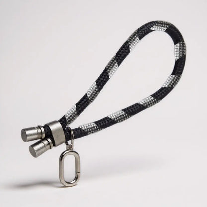 Lanyard de mano color negro para dispositivos móviles.