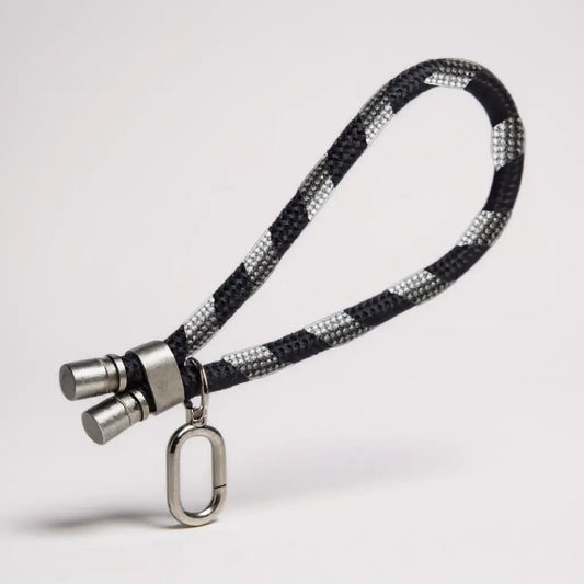 Lanyard de mano color negro para dispositivos móviles.