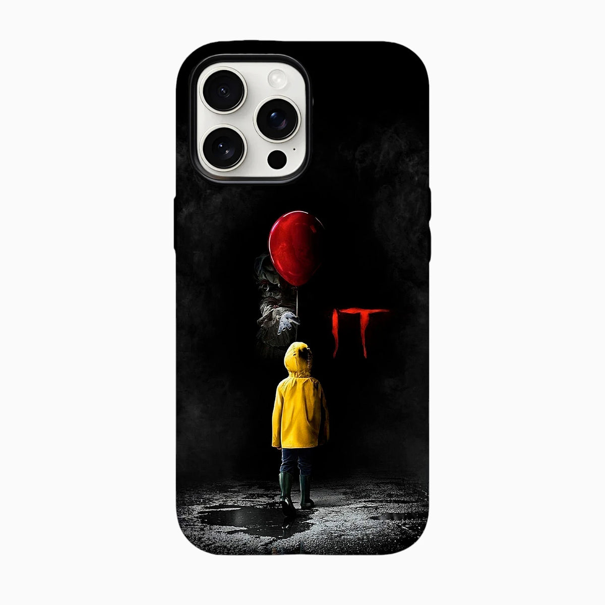 Ilustración de IT con Pennywise sosteniendo un globo rojo frente a un niño con impermeable amarillo, sobre una calle oscura y mojada.